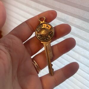 Gold Planet Key Pendant